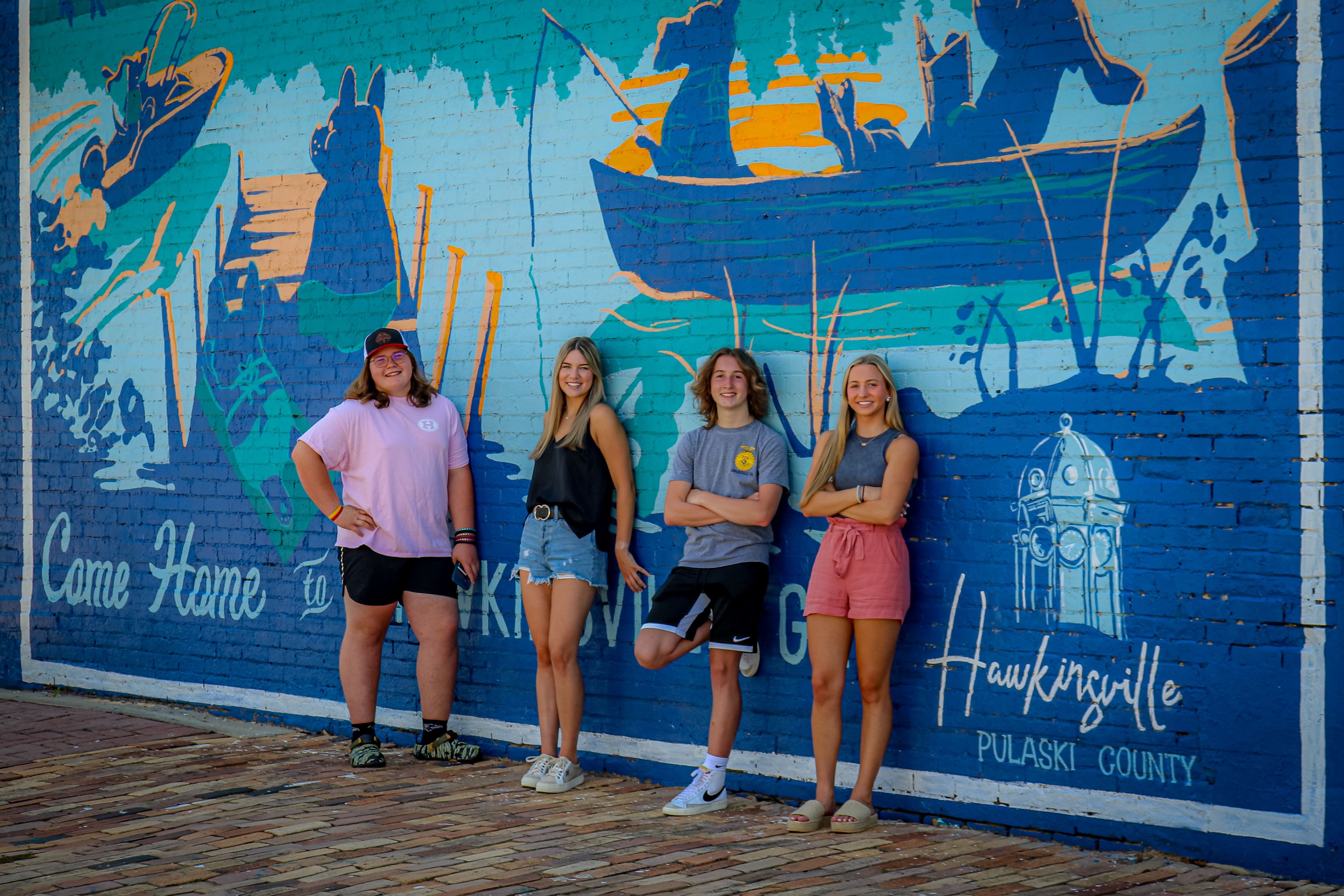 Hawkinsville's brand is prominently displayed on pole banners as well as utility trucks.