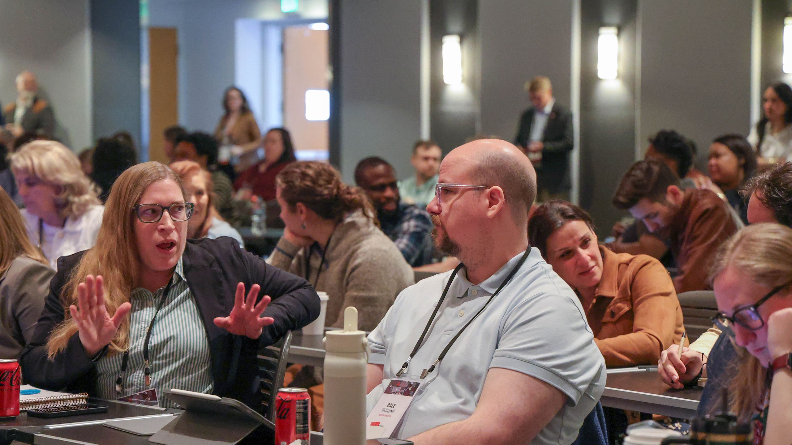 Audience members interact between sessions at the 2026 Developing Data Analytics Capabilities Conference.