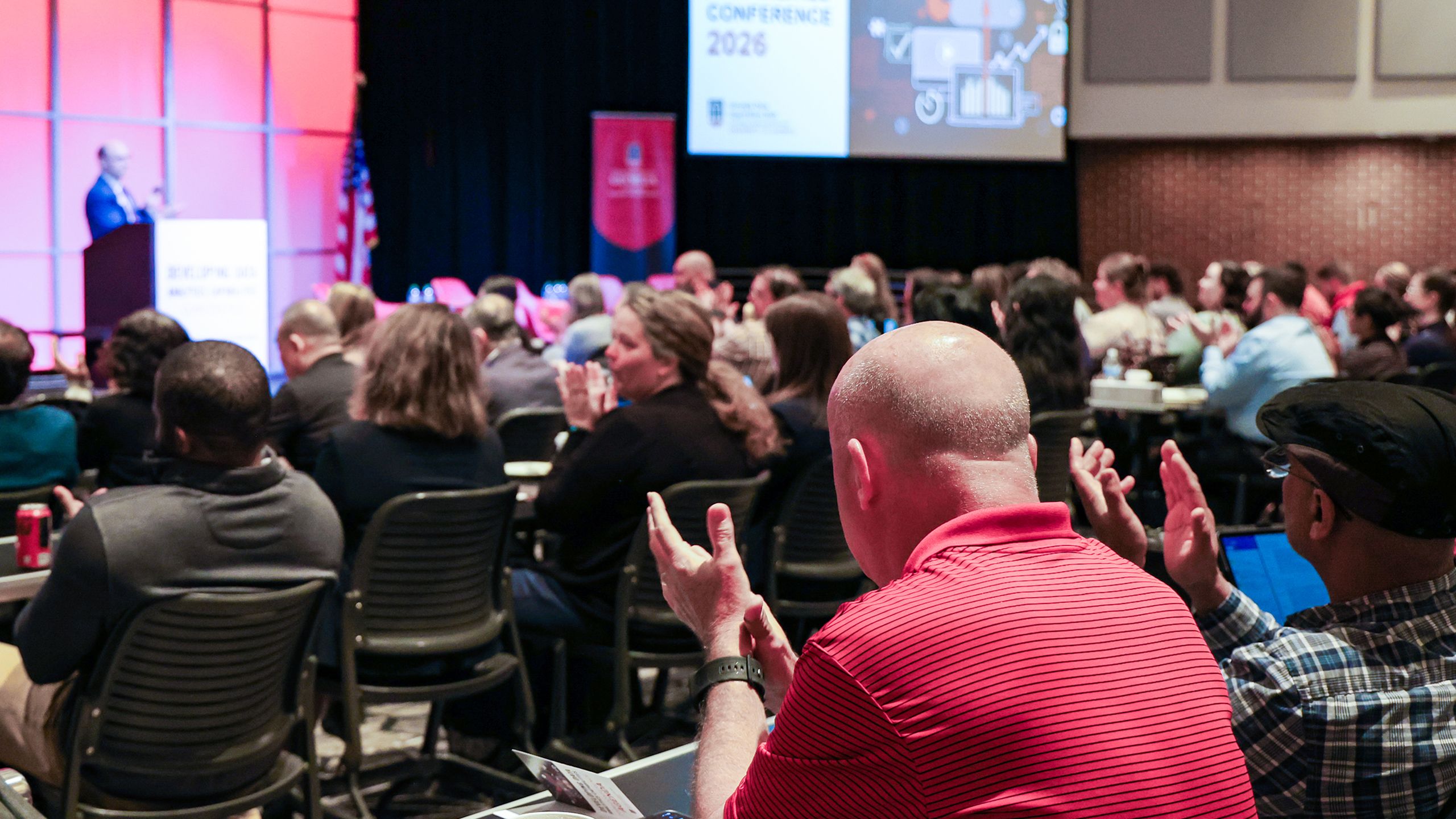 Attendees listen during a plenary session for the 2026 Developing Data Analytics Capabilities Conference.