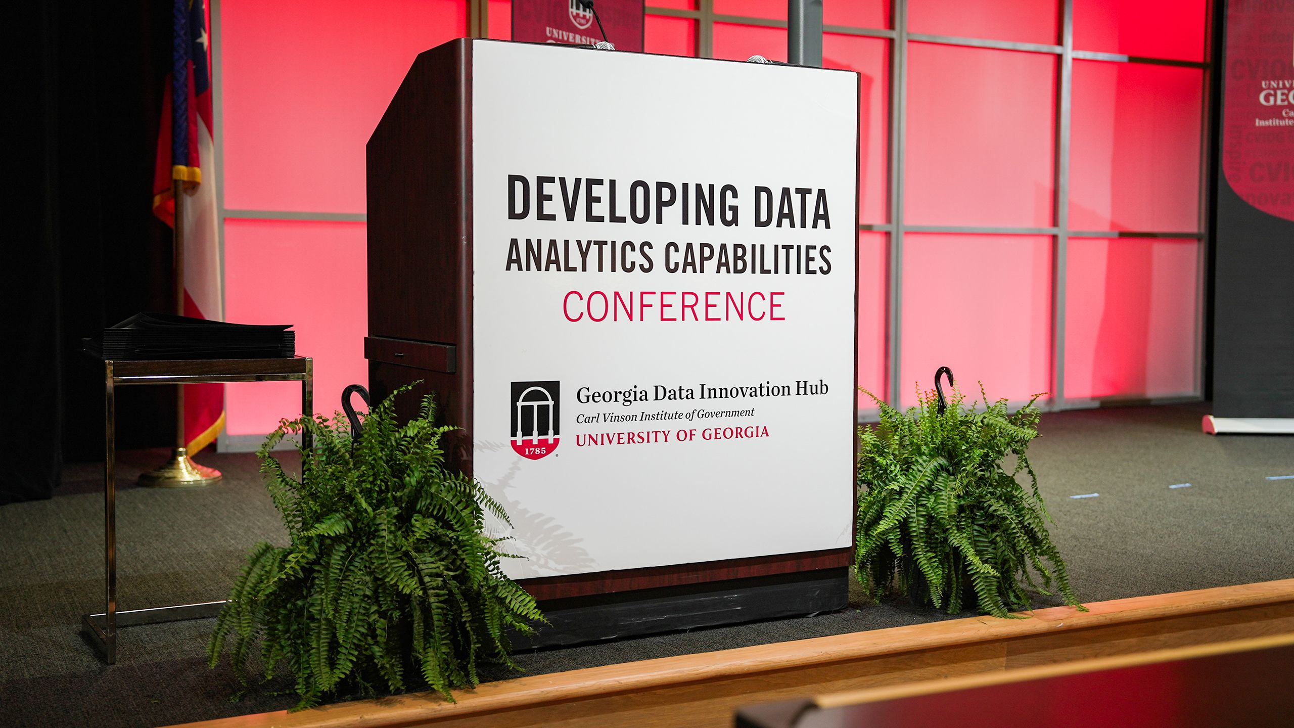 The podium on the main stage for the 2026 Developing Data Analytics Capabilities Conference. 